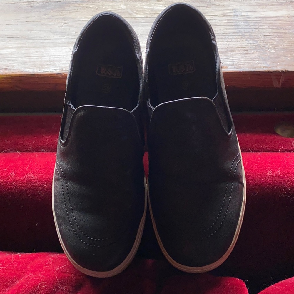 Black leather slip on sneakers
